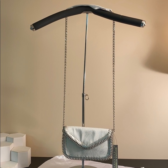 white clutch bag with silver chain